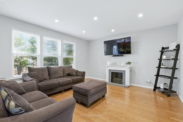16347 W Cagwin Dr, Lockport, IL 60441 - living room with light wood-type flooring, recessed lighting, and a brick fireplace
