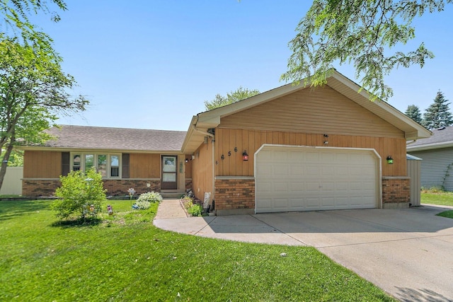 view of front of property featuring brick siding, a front lawn, driveway, and an attached garage