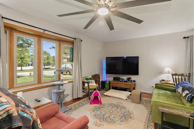 living room featuring wood finished floors and ceiling fan