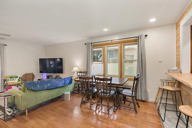 dining space with light wood-style floors and recessed lighting