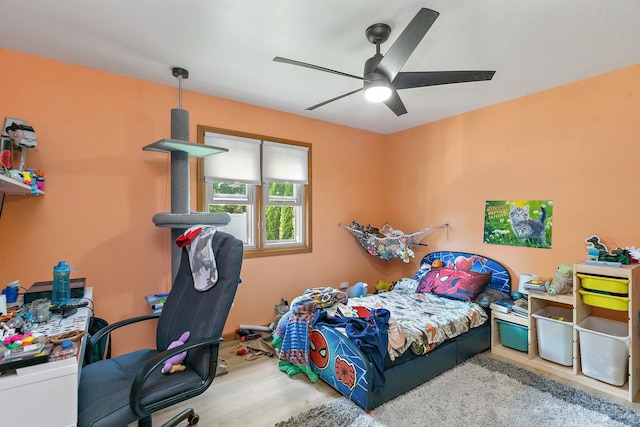 bedroom featuring wood finished floors and ceiling fan