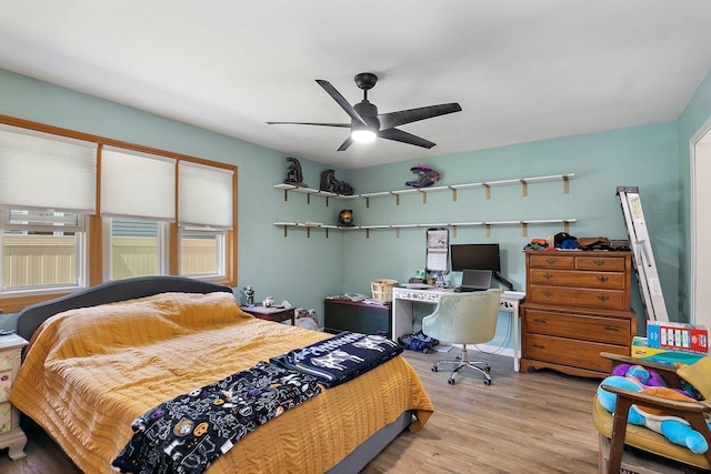 bedroom with wood finished floors and a ceiling fan