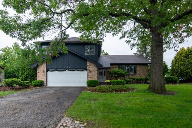 3142 Monterey Dr, Flossmoor, IL 60422 - split level home with asphalt driveway, brick siding, a front lawn, and an attached garage