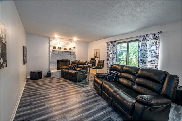 3142 Monterey Dr, Flossmoor, IL 60422 - living room with dark wood-style flooring, a textured ceiling, a brick fireplace, and baseboards