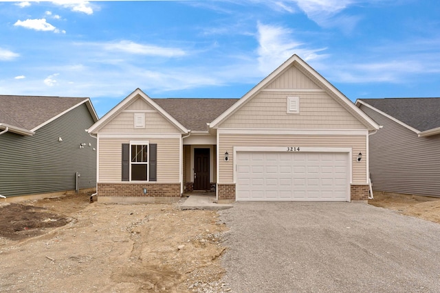 3214 Lincoln Prairie Blvd, Aurora, IL 60503 - view of front of house featuring brick siding, asphalt driveway, and an attached garage