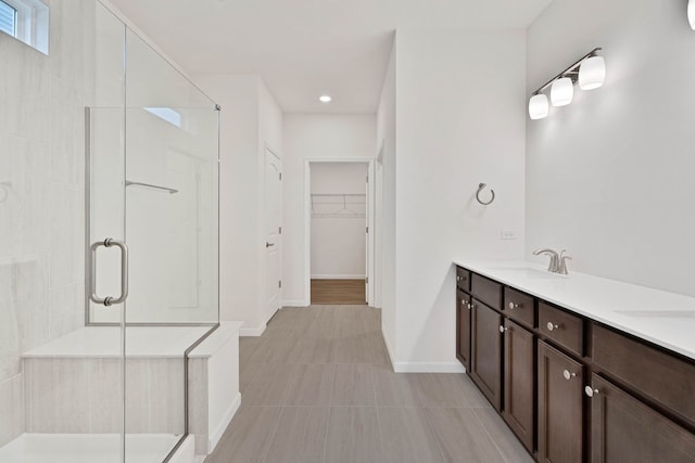 3214 Lincoln Prairie Blvd, Aurora, IL 60503 - full bathroom with a stall shower, a spacious closet, double vanity, tile patterned floors, and baseboards