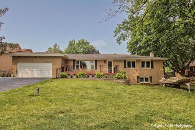34942 N Gogol Ave, Ingleside, IL 60041 - ranch-style home featuring a chimney, a garage, brick siding, a front lawn, and driveway