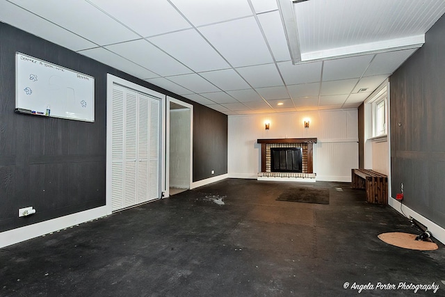 34942 N Gogol Ave, Ingleside, IL 60041 - unfurnished living room featuring a fireplace and concrete floors