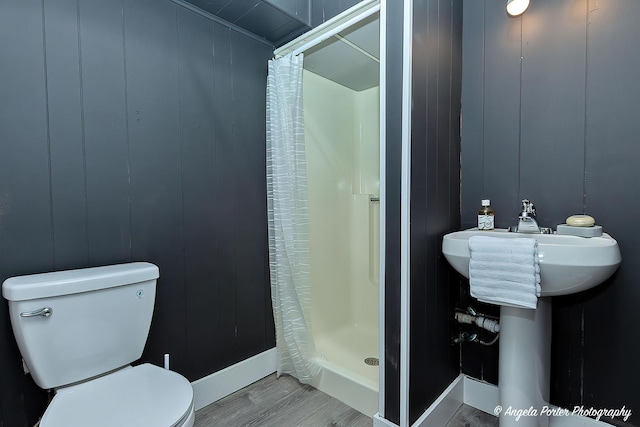 34942 N Gogol Ave, Ingleside, IL 60041 - full bathroom featuring a shower stall, wood finished floors, and a decorative wall