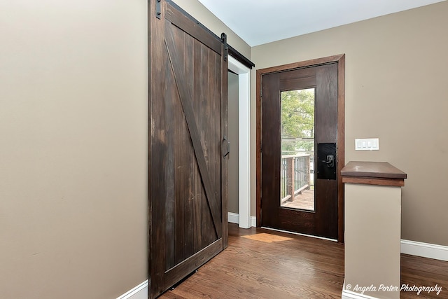 34942 N Gogol Ave, Ingleside, IL 60041 - foyer entrance featuring a barn door and wood finished floors