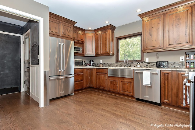 34942 N Gogol Ave, Ingleside, IL 60041 - kitchen with appliances with stainless steel finishes, dark wood finished floors, brown cabinets, recessed lighting, and light stone countertops