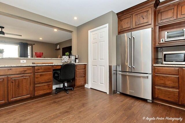 34942 N Gogol Ave, Ingleside, IL 60041 - kitchen featuring appliances with stainless steel finishes, dark wood-style floors, recessed lighting, light stone counters, and built in study area