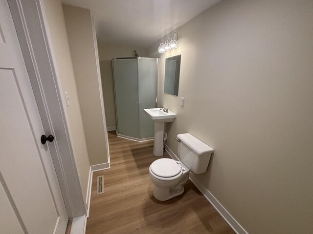 112 W 6th St, Gridley, IL 61744 - bathroom with wood finished floors and a shower