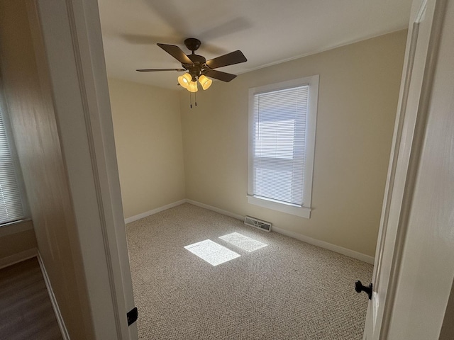 112 W 6th St, Gridley, IL 61744 - unfurnished room with dark colored carpet and a ceiling fan