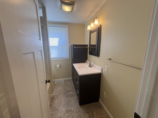 112 W 6th St, Gridley, IL 61744 - bathroom featuring vanity and tile patterned floors