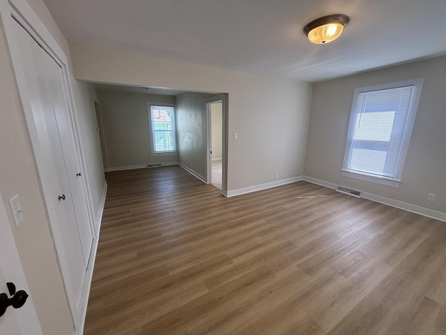 112 W 6th St, Gridley, IL 61744 - empty room featuring wood finished floors and baseboards