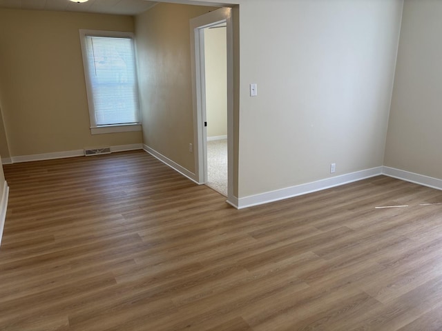 112 W 6th St, Gridley, IL 61744 - spare room with baseboards and wood finished floors