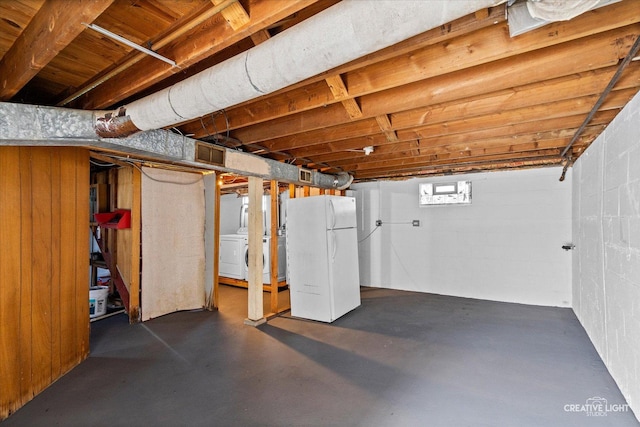 424 Howard Ave, Aurora, IL 60506 - unfinished basement with freestanding refrigerator and washer / dryer