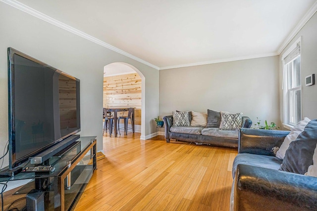 3829 S Austin Blvd, Cicero, IL 60804 - living room featuring arched walkways, light wood-style floors, crown molding, and baseboards