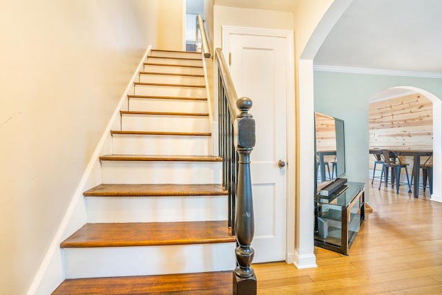 3829 S Austin Blvd, Cicero, IL 60804 - staircase featuring arched walkways, wood finished floors, crown molding, and baseboards