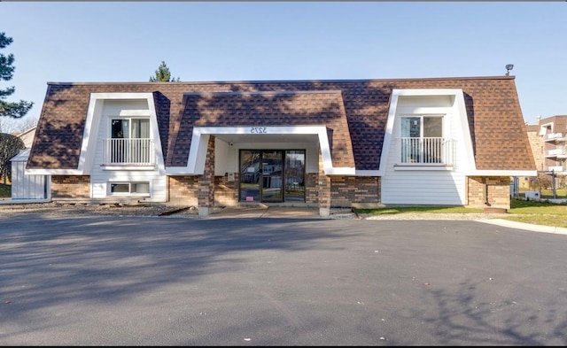 3300 N Carriageway Dr Unit 209, Arlington Heights, IL 60004 - view of front of home featuring brick siding