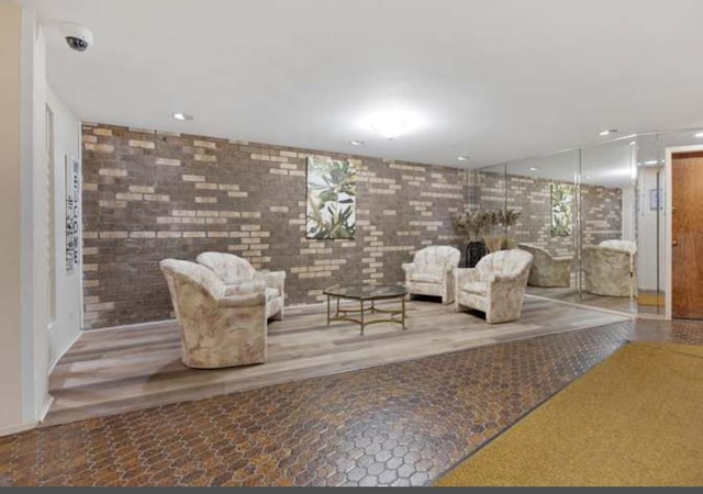 3300 N Carriageway Dr Unit 209, Arlington Heights, IL 60004 - common area featuring recessed lighting, brick wall, and a surveillance system