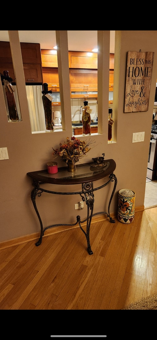 3300 N Carriageway Dr Unit 209, Arlington Heights, IL 60004 - corridor with light wood finished floors