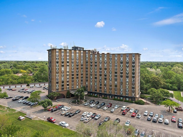 1 Renaissance Pl Unit 3Ph, Palatine, IL 60067 - view of building exterior with uncovered parking and a wooded view