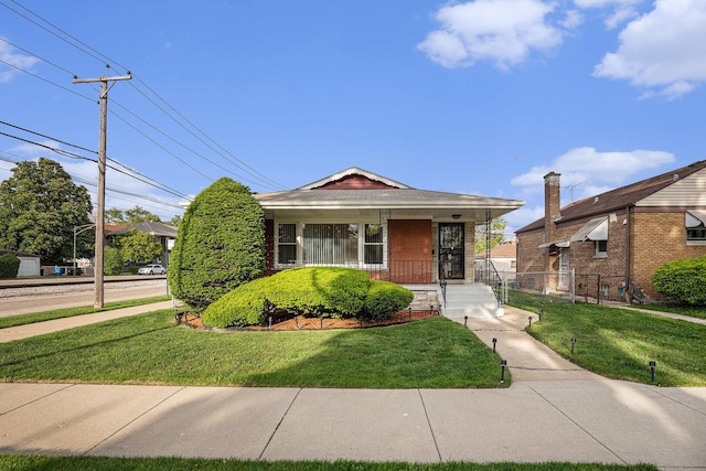 12101 S Lafayette Ave, Chicago, IL 60628 - bungalow with a front yard and covered porch