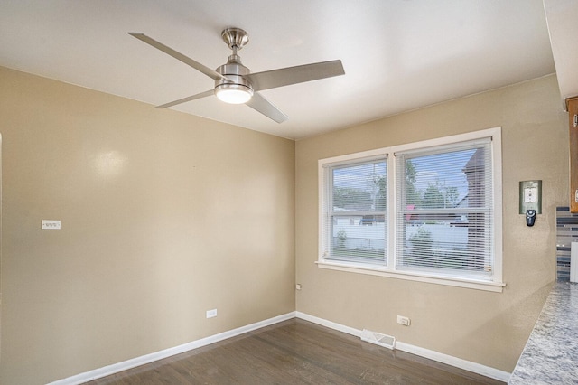 12101 S Lafayette Ave, Chicago, IL 60628 - unfurnished room featuring dark wood finished floors, ceiling fan, and baseboards