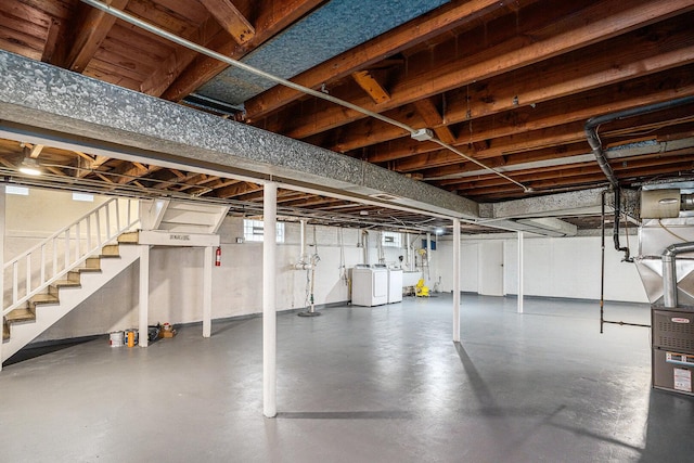 12101 S Lafayette Ave, Chicago, IL 60628 - unfinished basement with washing machine and dryer, stairway, and a sink
