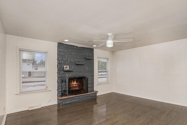 12101 S Lafayette Ave, Chicago, IL 60628 - unfurnished living room featuring wood finished floors, a stone fireplace, a ceiling fan, baseboards, and recessed lighting