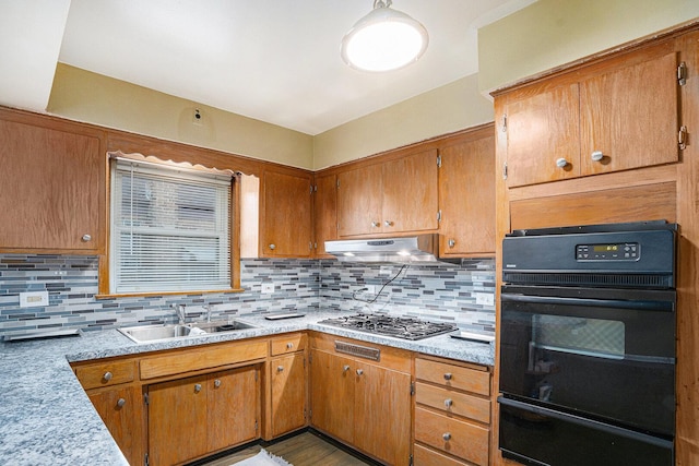 12101 S Lafayette Ave, Chicago, IL 60628 - kitchen with oven, a warming drawer, stainless steel gas cooktop, a sink, and decorative backsplash