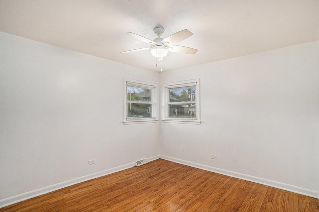 12101 S Lafayette Ave, Chicago, IL 60628 - empty room with light wood-style flooring, baseboards, and a ceiling fan