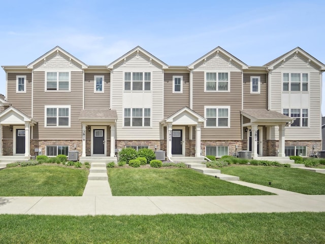 3808 Honeysuckle Ln, Elgin, IL 60124 - view of property with stone siding and a front yard