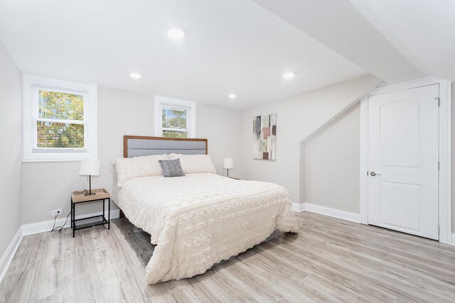 12533 S Lowe Ave, Chicago, IL 60628 - bedroom with light wood finished floors, baseboards, and recessed lighting