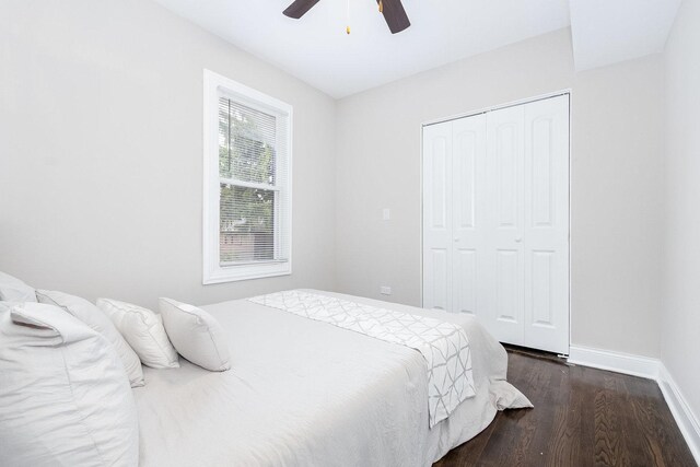 12533 S Lowe Ave, Chicago, IL 60628 - bedroom with baseboards, dark wood-style flooring, a closet, and ceiling fan