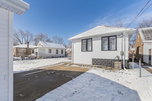 12533 S Lowe Ave, Chicago, IL 60628 - snow covered property featuring central air condition unit