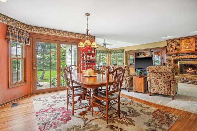 5N647 Forest Glen Ln, Saint Charles, IL 60175 - dining room featuring wood finished floors, a fireplace, baseboards, a ceiling fan, and lofted ceiling