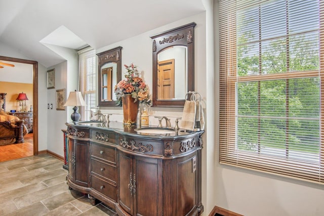 5N647 Forest Glen Ln, Saint Charles, IL 60175 - bathroom with double vanity, vaulted ceiling, baseboards, and ensuite bathroom