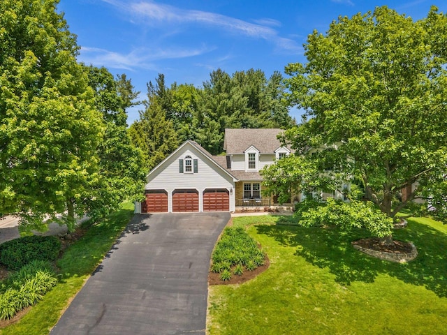 5N647 Forest Glen Ln, Saint Charles, IL 60175 - view of front of home featuring asphalt driveway, a garage, and a front lawn