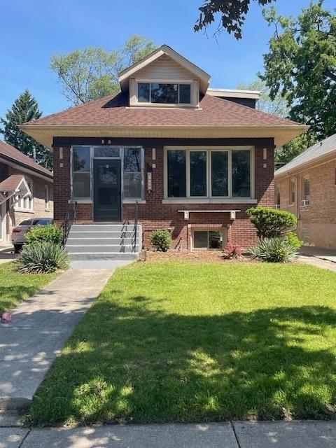 1724 W 105th St, Chicago, IL 60643 - bungalow-style house featuring a front lawn and brick siding