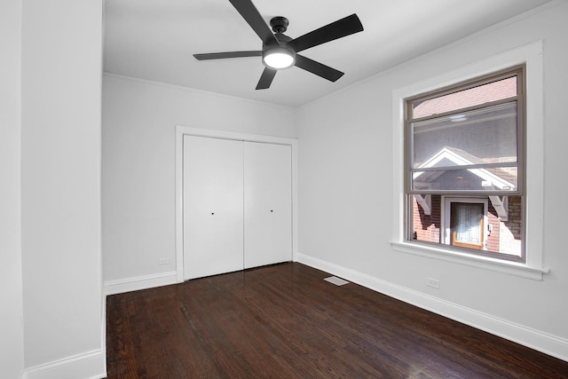 1724 W 105th St, Chicago, IL 60643 - unfurnished bedroom with dark wood-type flooring, multiple windows, baseboards, a closet, and ornamental molding