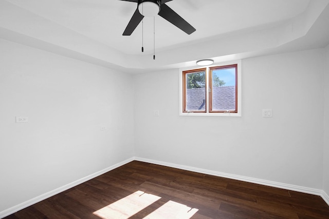 1724 W 105th St, Chicago, IL 60643 - unfurnished room featuring baseboards, dark wood-style flooring, a tray ceiling, and a ceiling fan