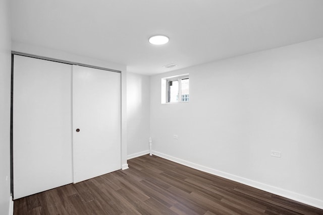 1724 W 105th St, Chicago, IL 60643 - unfurnished bedroom featuring dark wood-type flooring, a closet, and baseboards