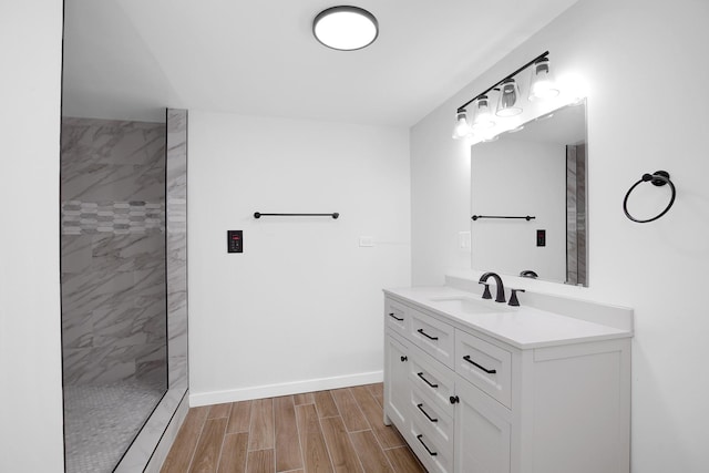 1724 W 105th St, Chicago, IL 60643 - full bath with vanity, tiled shower, wood tiled floors, and baseboards