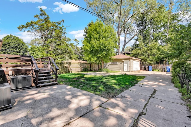 1724 W 105th St, Chicago, IL 60643 - view of yard with an outdoor structure, a garage, a wooden deck, central AC, and concrete driveway