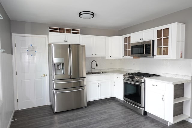 1330 Ridgeway Ave, Round Lake Beach, IL 60073 - kitchen featuring appliances with stainless steel finishes, a sink, white cabinetry, and light countertops