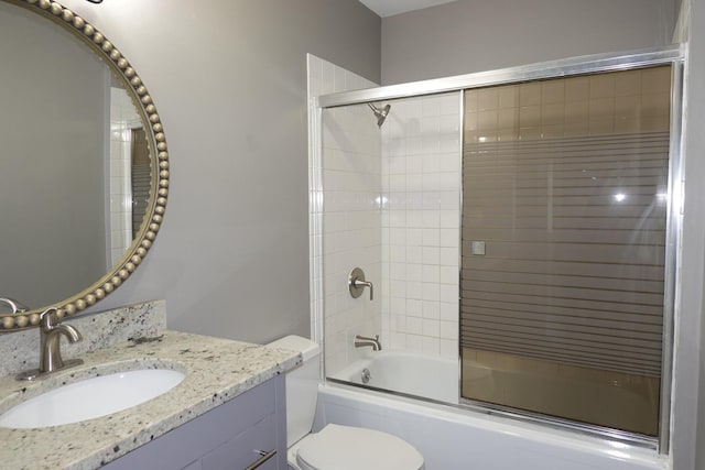 1330 Ridgeway Ave, Round Lake Beach, IL 60073 - bathroom featuring combined bath / shower with glass door, toilet, and vanity