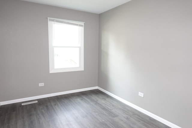 1330 Ridgeway Ave, Round Lake Beach, IL 60073 - spare room with dark wood-type flooring and baseboards